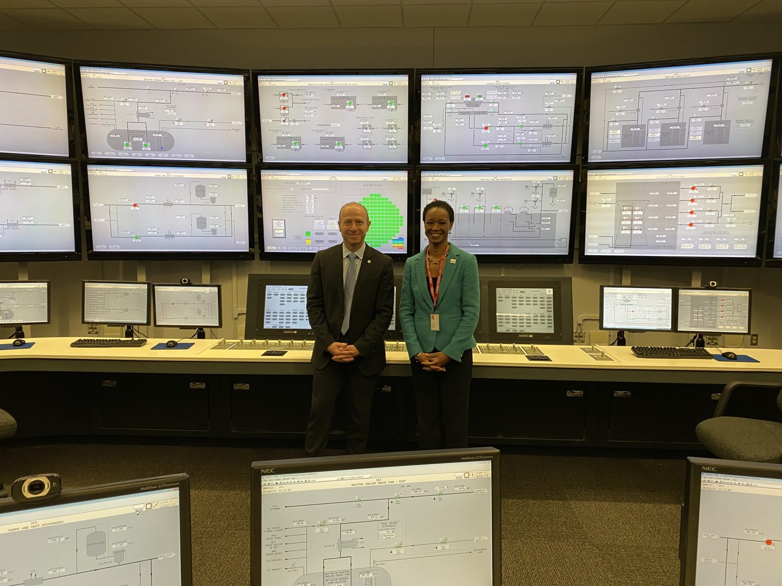 USTDA Director Ebong standing with Patrick Fragman, Westinghouse President and CEO.