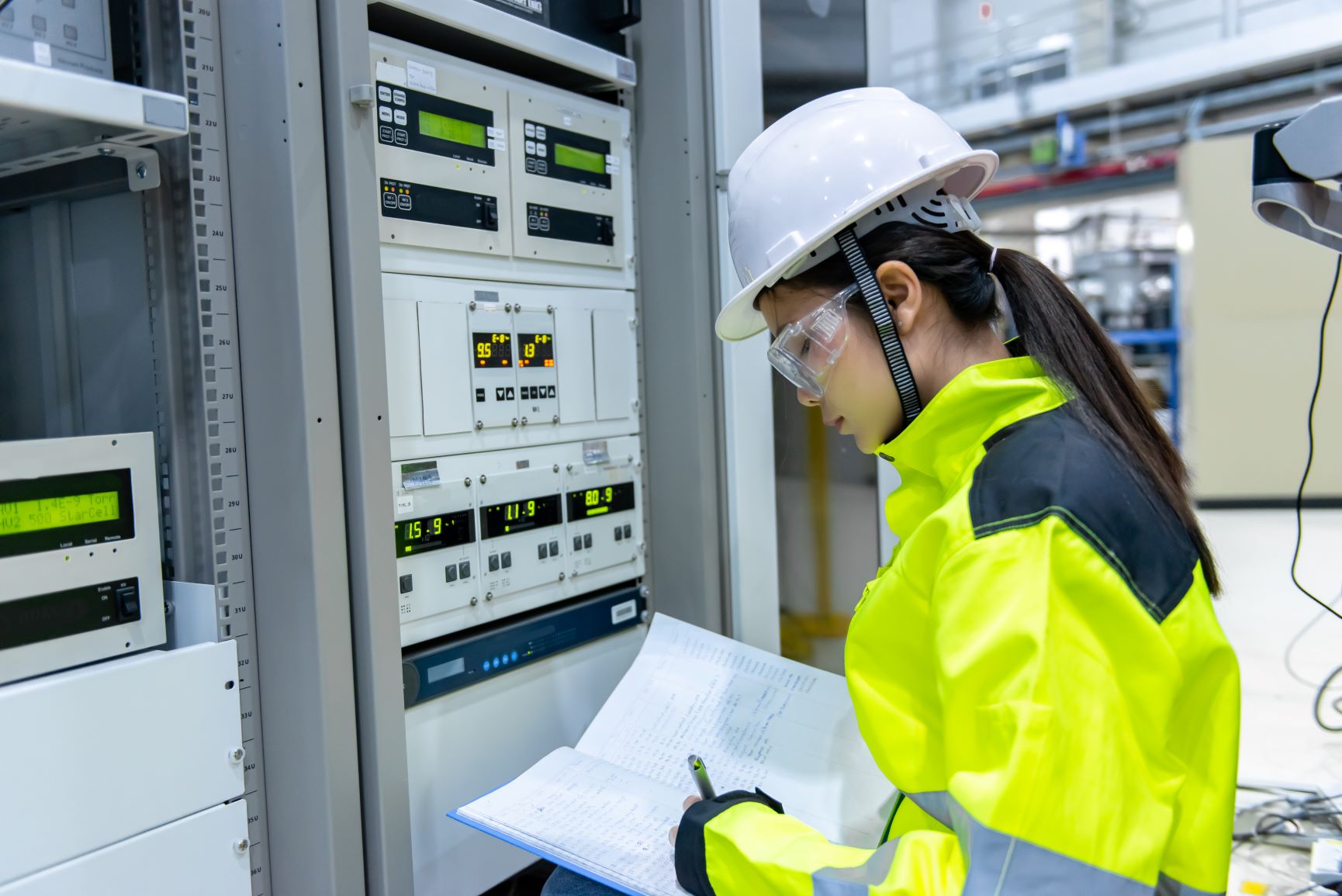 Thai woman monitoring power distribution equipment
