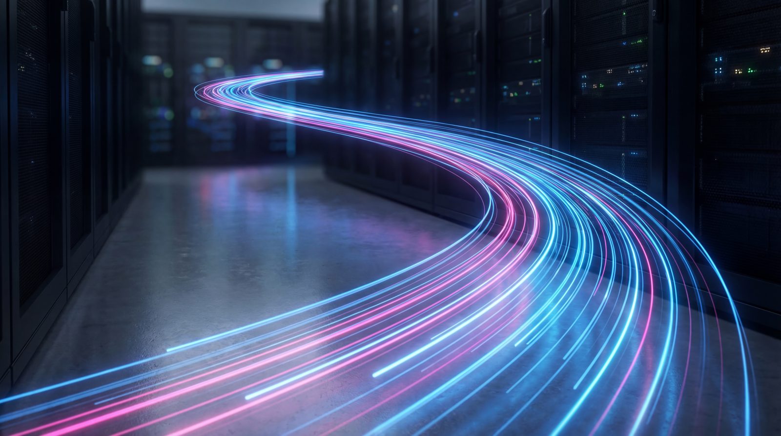 Stock image: Dynamic light trails flowing through a server room, symbolizing rapid data transfer and network speed.