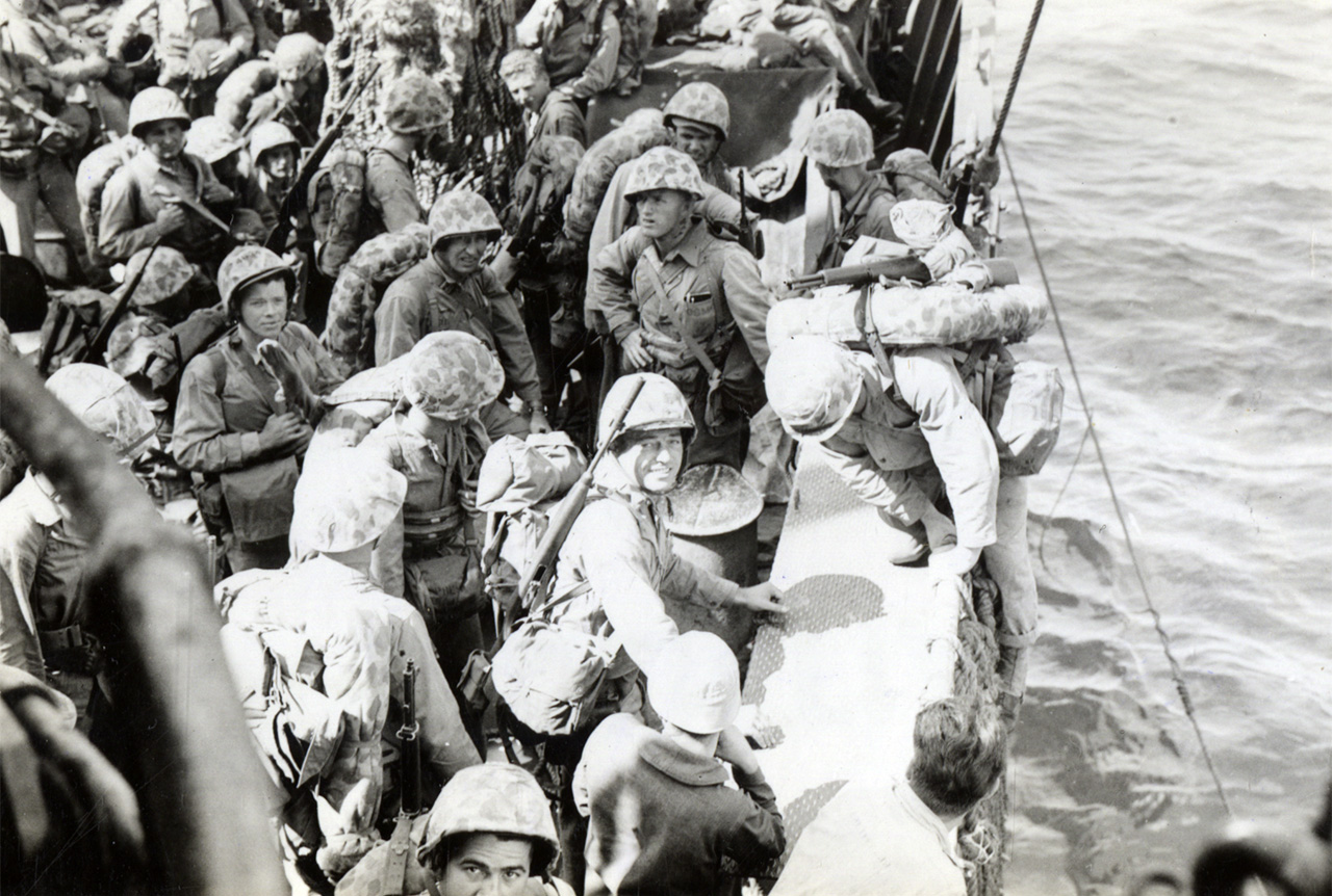 26th Marine Division aboard USS Hocking loading on to Higgins boats at Iwo Jima, Feb. 19, 1945. 