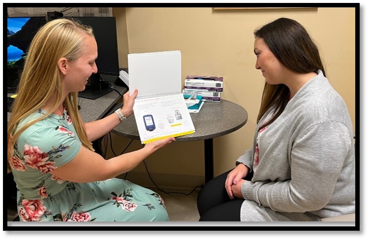 Pharmacist providing education in clinic