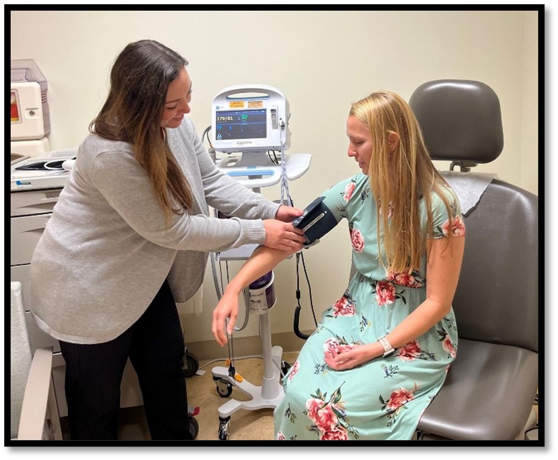 Pharmacist checking blood pressure