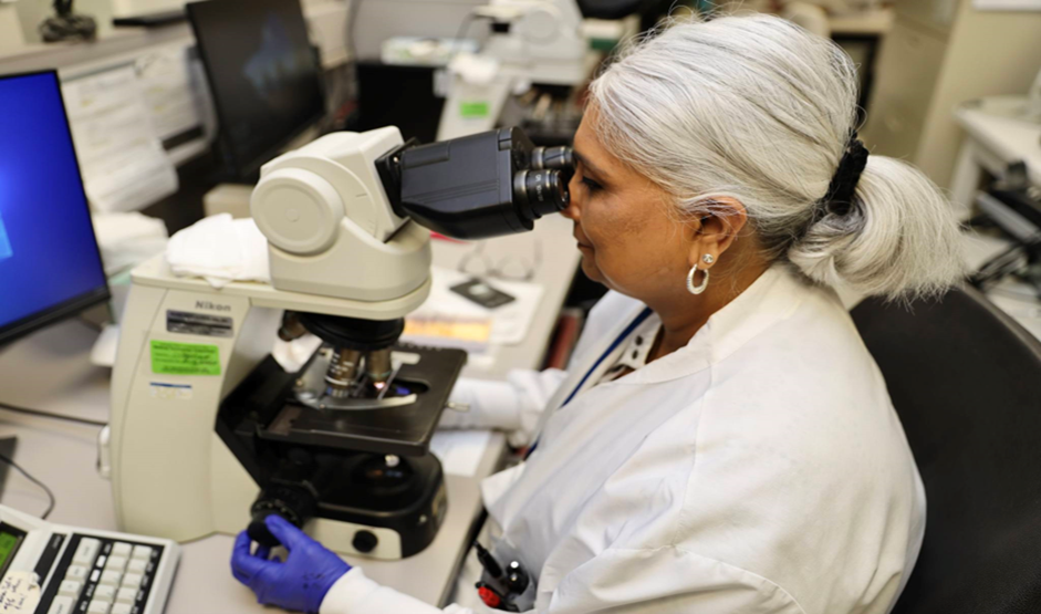 Medical Laboratory Scientist J.T. in the Hematology department at VACT performing peripheral smear review. 