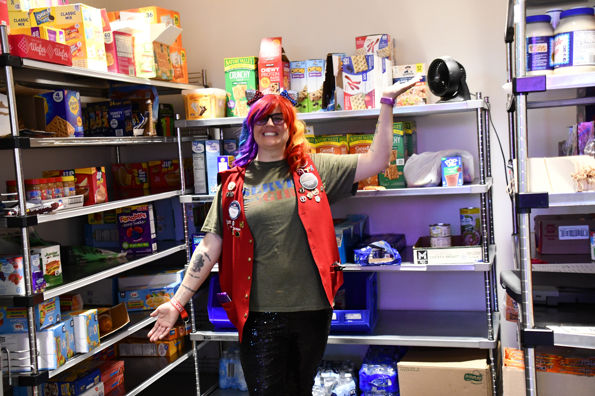 A volunteer poses in the Omaha VA Veterans Food Pantry. 