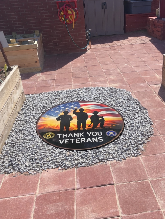 Circular plaque imbedded in the ground with 