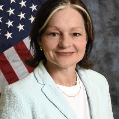 lisa sitting infront of flage