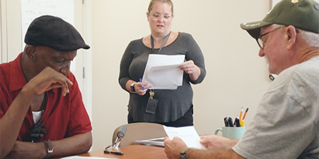 James Robinson and Wilton Bowles attend a smoking cessation class at the Ralph H. Johnson VAMC led by instruction Jamie Baker, NP. Photo by Michael Romeo. 