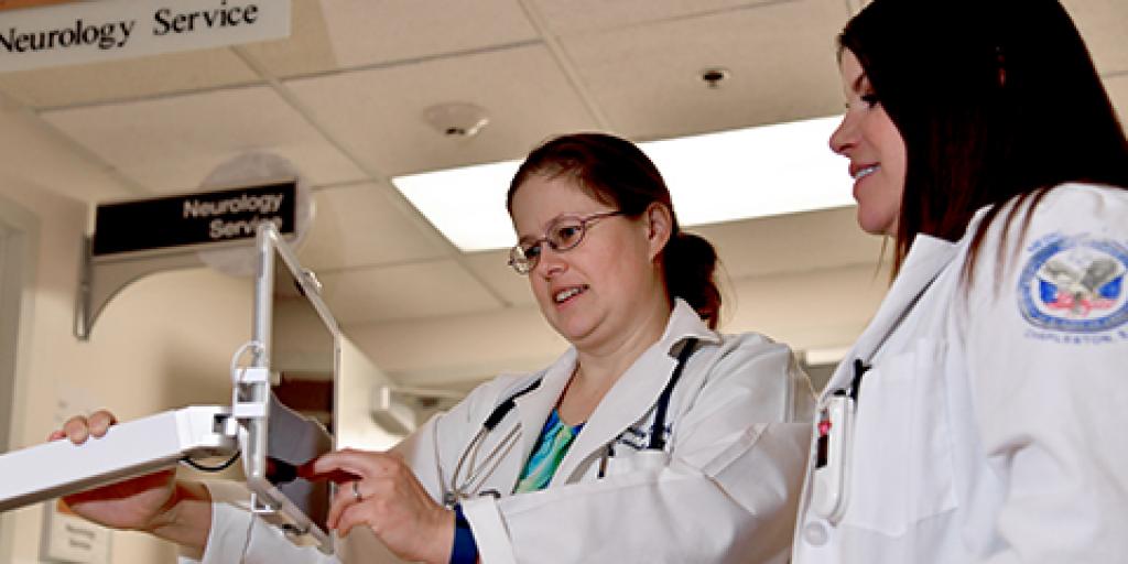 (Left to Right) Stroke Program Director Dr. Shelly Ozark and Stroke Program Coordinator Elizabeth Aprile test a new telestroke monitor. Photo by James Arrowood. 