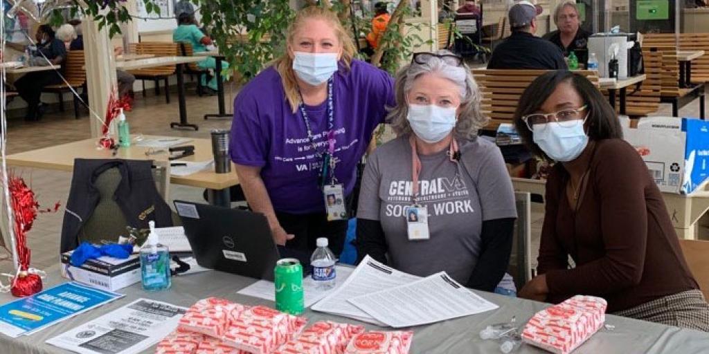 Three employees at a table