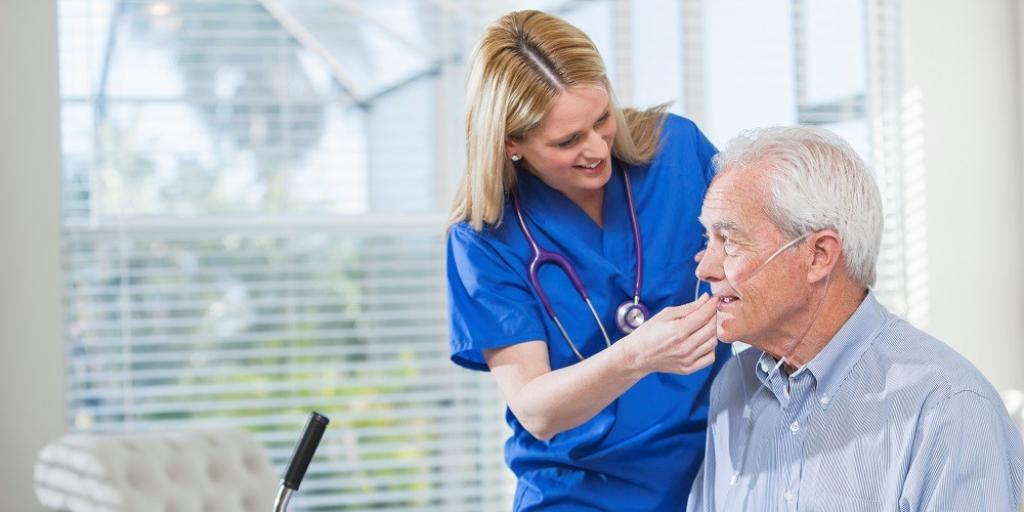 Nurse with an older male patient