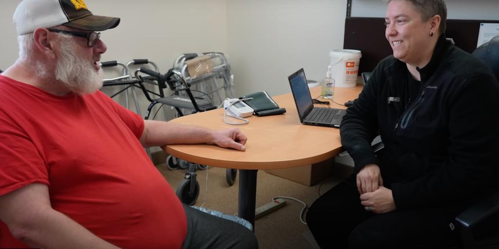 Jeff Luppen talks to one of his healthcare providers, Karen Dewey.
