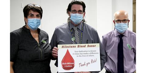 Rich Wilson (center), U.S. Navy Veteran and Supervisory Pharmacy Technician at Coatesville VA Medical Center poses for a photo. On either side of him are Dr. Michael Gliatto, Coatesville VAMC’s Chief of Staff (right) and Jennifer Lilly, Chief of the Center for Development and Community Engagement at Coatesville VAMC and the Blood Drive organizer.