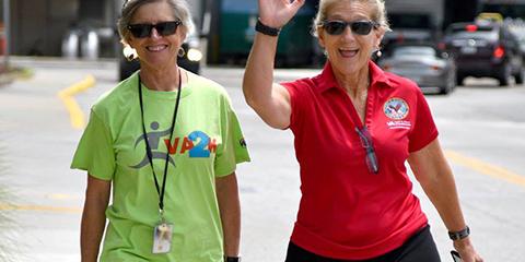 MOVE Coordinator Rebecca Luhrs, RN and Clinical Nurse Educator Jan Shriner, RN welcome other walkers during the VA2K. Photo by James Arrowood. 