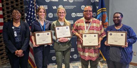 Nursing honorees holding their plaques