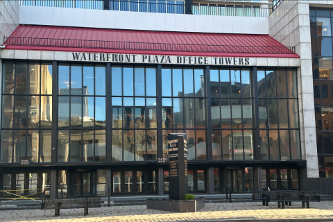 Louisville Regional Benefits Office. Waterfront Plaza Office Towers. Large glass windows with red roof awning.
