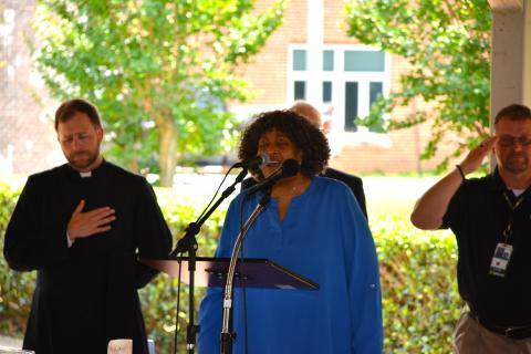 Chaplain Angela C. Peterkin, a chaplain educator with the Salisbury VA Health Care System, sings the national anthem.