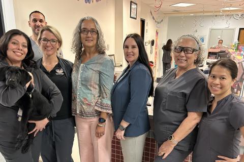 Dr. Milo posing with Nightingale and the nurses of 7A Bartter Clinical Research Unit (BCRU); Million Veteran Program.
