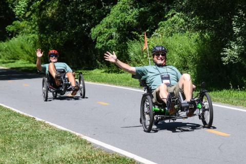 Veterans participate in the cycling portion of the VA New England Summer Sports Clinic on the East Bay Bike Path in Barrington, Rhode Island.