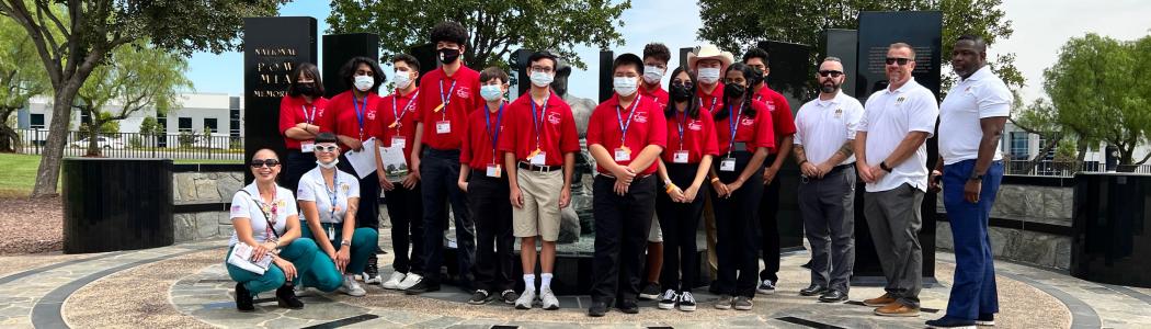 Youth Volunteers and Team VA Loma Linda pose at Veterans monument